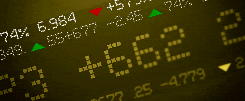 A detailed view of a stock market display showing fluctuating numbers, representing traders achieving success in the forex market.