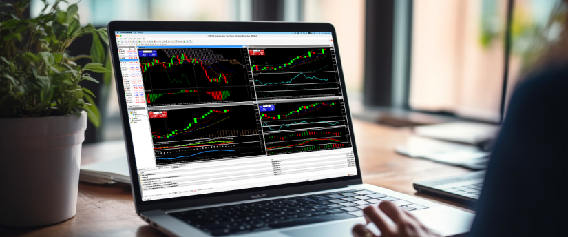  A person focused on a laptop screen, analyzing stock market data and trends in a professional setting.