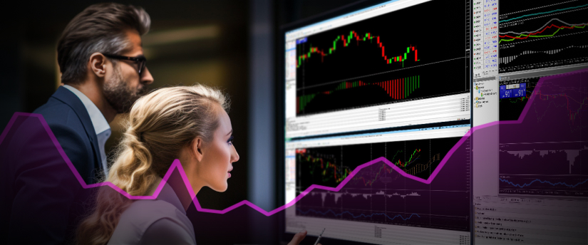Dos personas se concentran en la pantalla de un ordenador con un gráfico, colaborando en la interpretación de los datos.