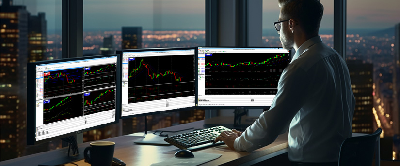A man at a desk with three monitors displaying various stock market graphs, using MT4 for trading analysis.