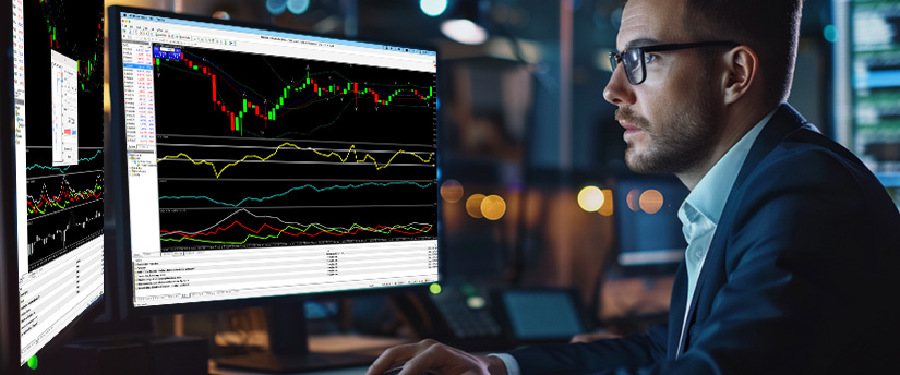 A professional trader studying live charts and indicators to understand the basics of metals trading and market analysis.