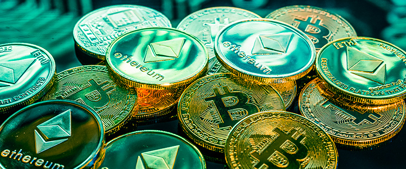 A scattered pile of physical gold and green-tinted Bitcoin and Ethereum tokens, capturing the visual essence of major digital assets for crypto news bitcoin ethereum reporting.
