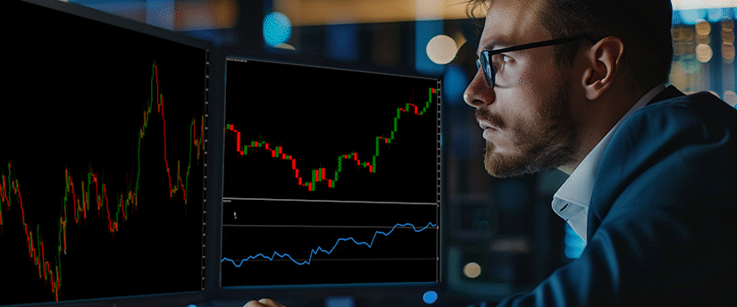 A male investor comparing forex vs day trading strategies while looking at live market data on an MT4 platform. The multiple desktop monitors display technical analysis candlestick charts and trading indicators.