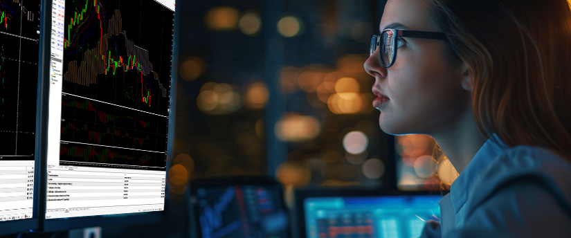 Trader analyzing precious metals price charts and technical indicators on a trading platform