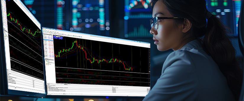 Woman analysing stock index charts and technical indicators on a trading platform